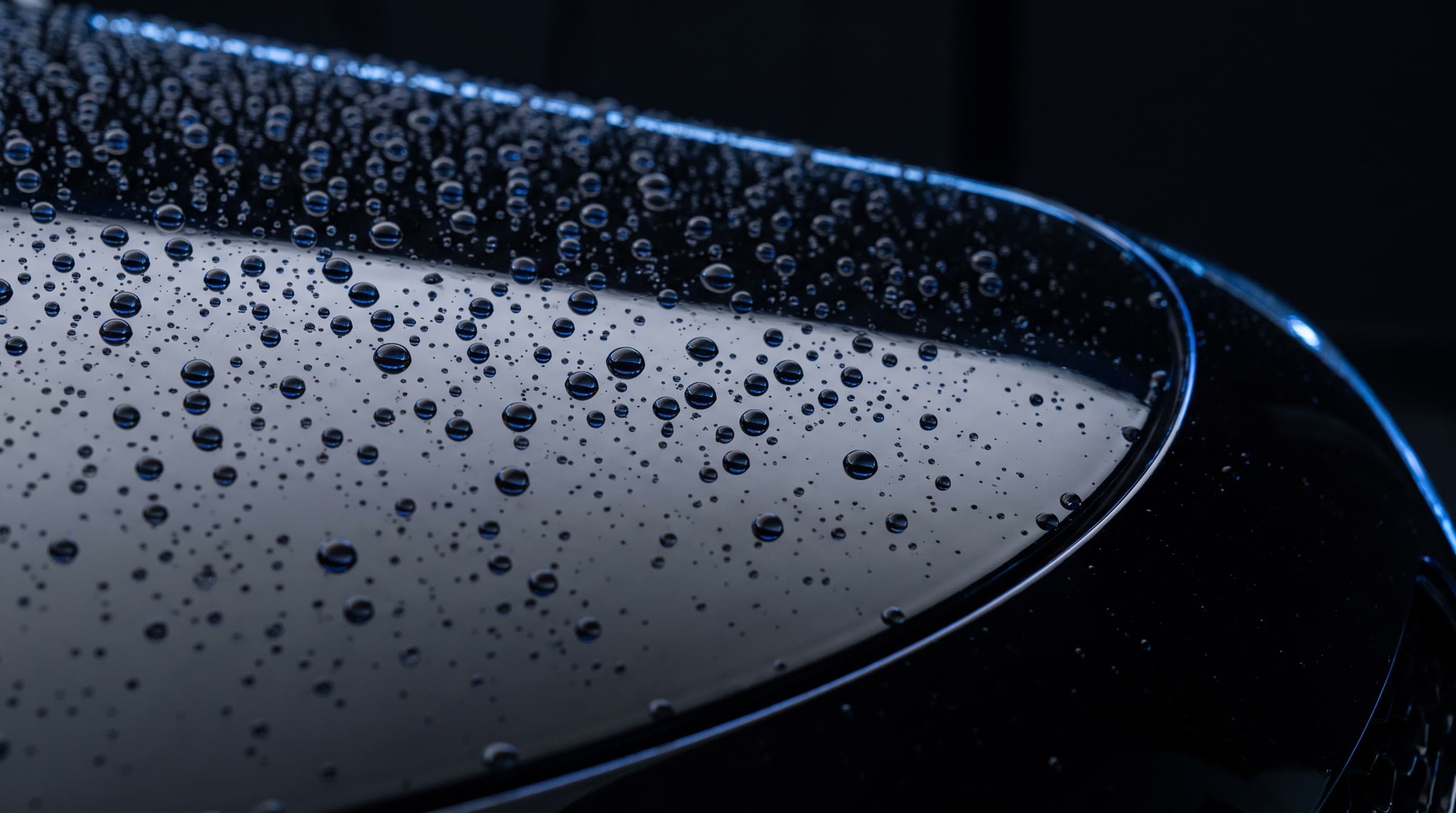 Water beading on black ceramic-coated paint